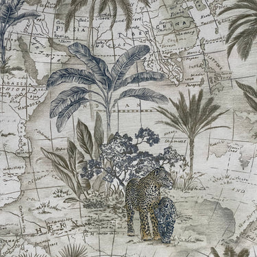 Fabric with a leopard and palm tree design on a map background